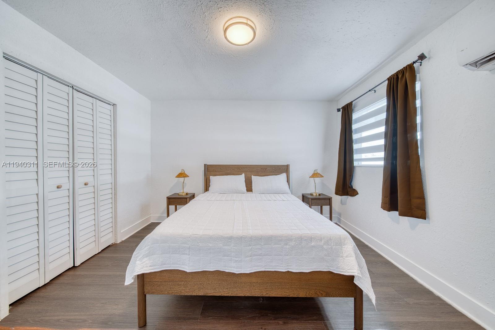 2741 Southwest 67th Avenue, Unit 1 Miami, FL 33155 - Photo 15 of 24 a bedroom with a bed and a window