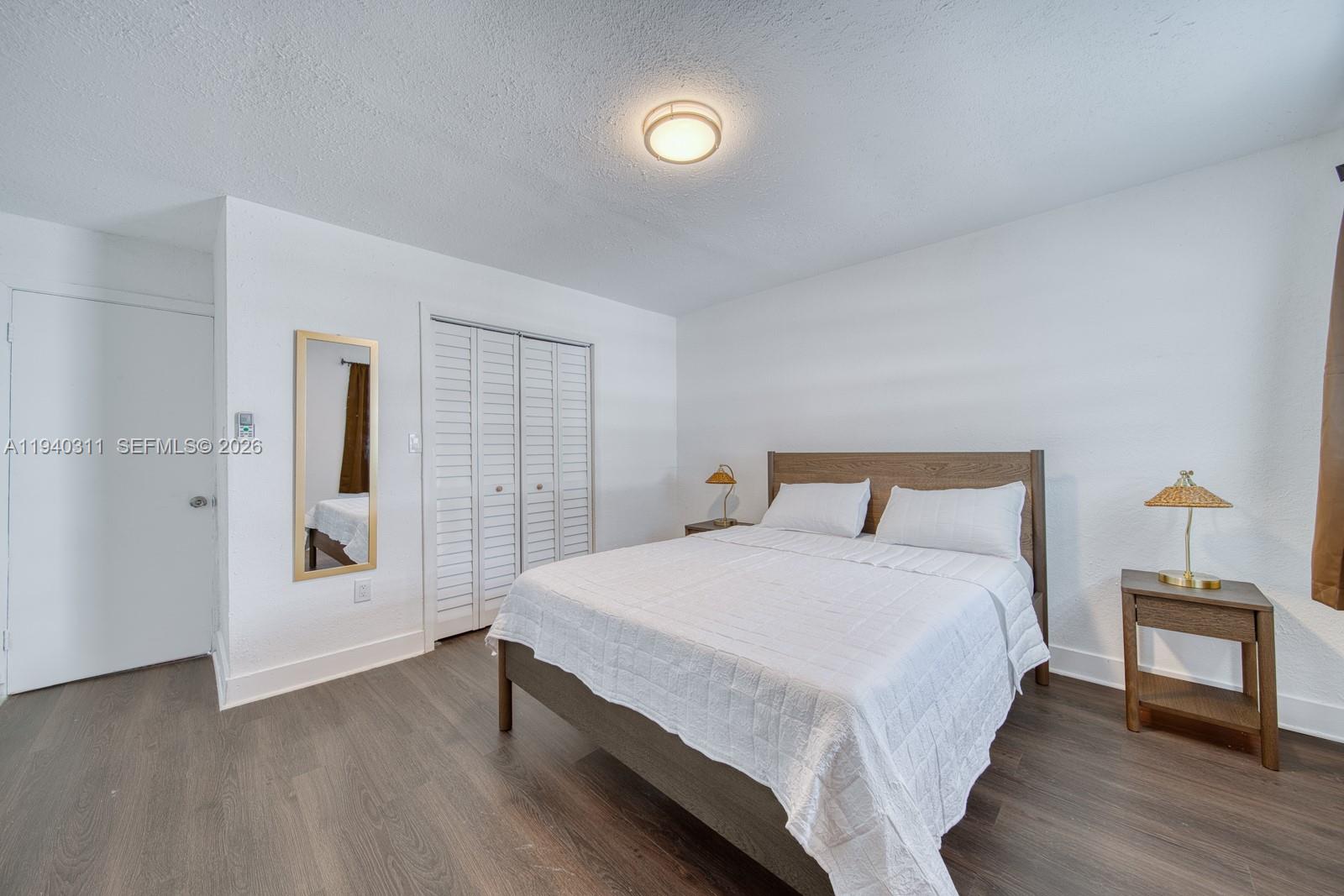 2741 Southwest 67th Avenue, Unit 1 Miami, FL 33155 - Photo 20 of 24 a bedroom with a bed and a window