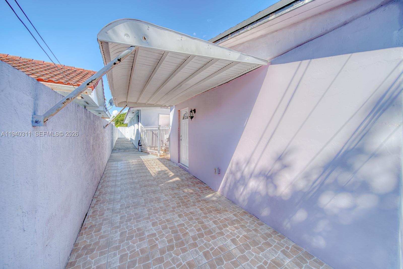 2741 Southwest 67th Avenue, Unit 1 Miami, FL 33155 - Photo 22 of 24 a view of a back yard of a house