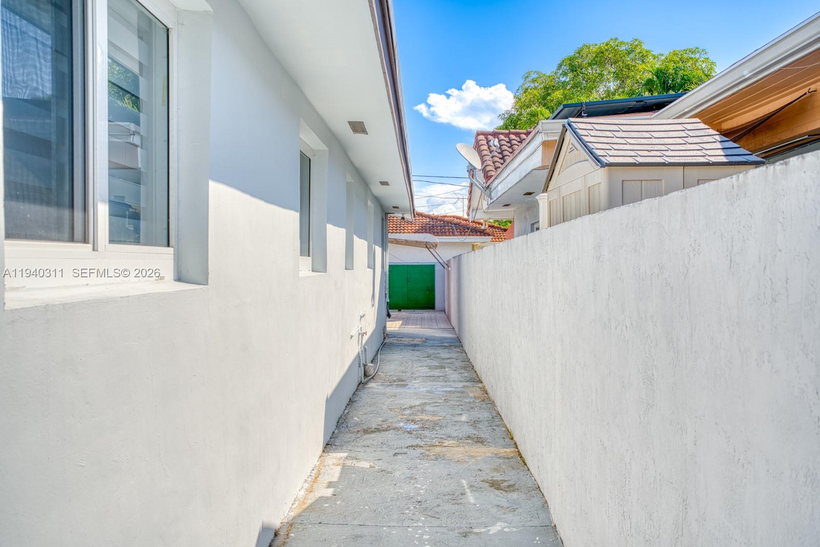 2741 Southwest 67th Avenue, Unit 1 Miami, FL 33155 - Photo 24 of 24 a view of a patio with table and chairs