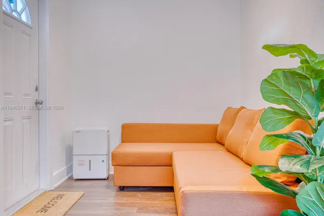 a blue and white sitting area with a rug