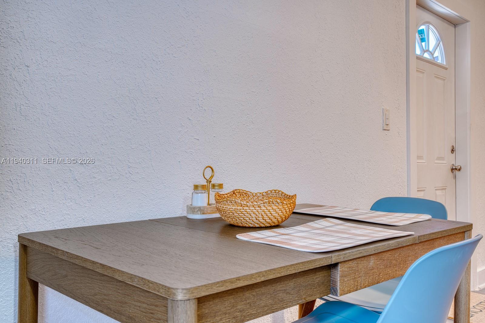 2741 Southwest 67th Avenue, Unit 1 Miami, FL 33155 - Photo 6 of 24 a living room with a table and chairs