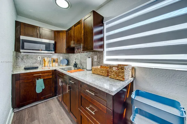 a kitchen with a stove and a sink