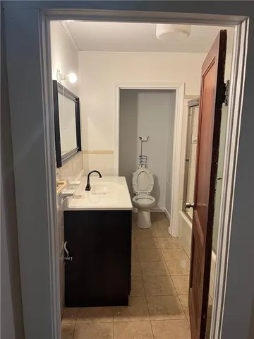 a view of a bunch of trees in front of house