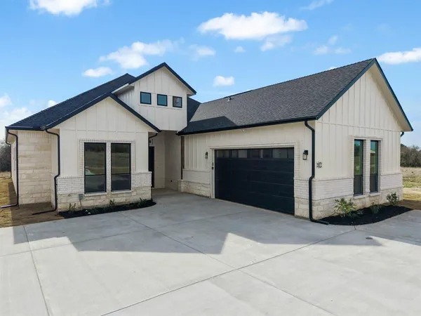 a front view of a house with a garage