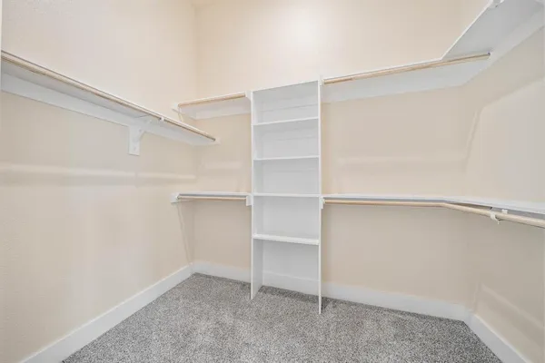 a view of an empty walk in closet