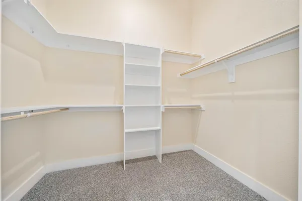 a view of an empty walk in closet