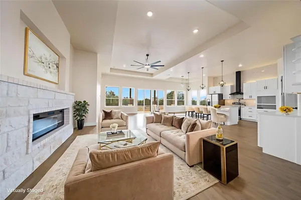 a living room with furniture fireplace and a fireplace