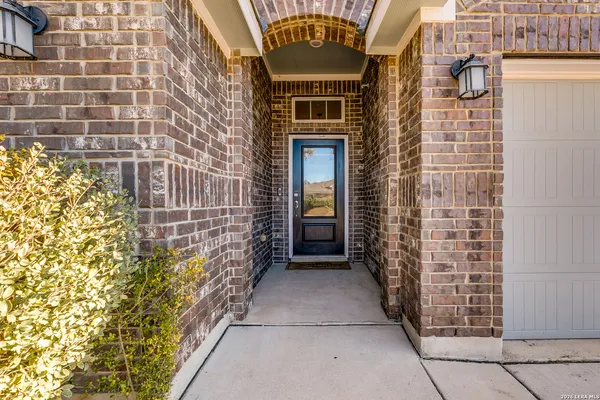 a view of entryway with brick walls