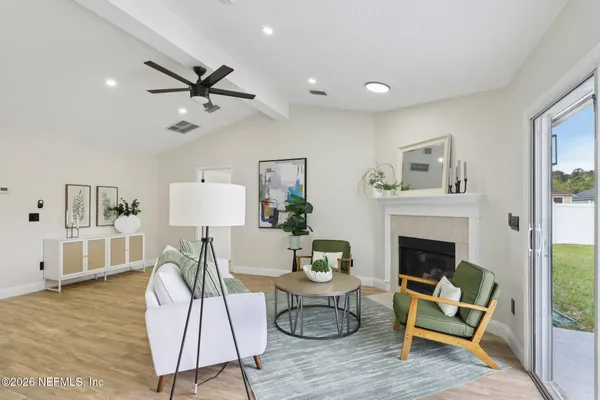 a living room with furniture and a fireplace
