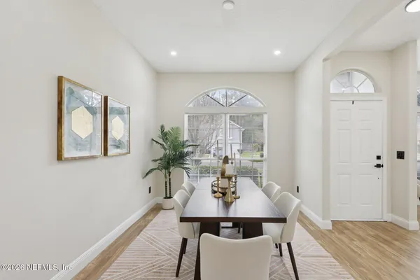 a view of a dining room with furniture window and wooden floor