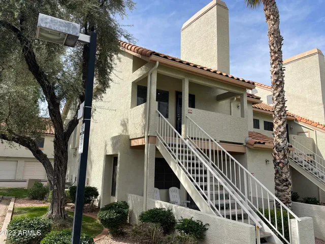 front view of a house with iron stairs