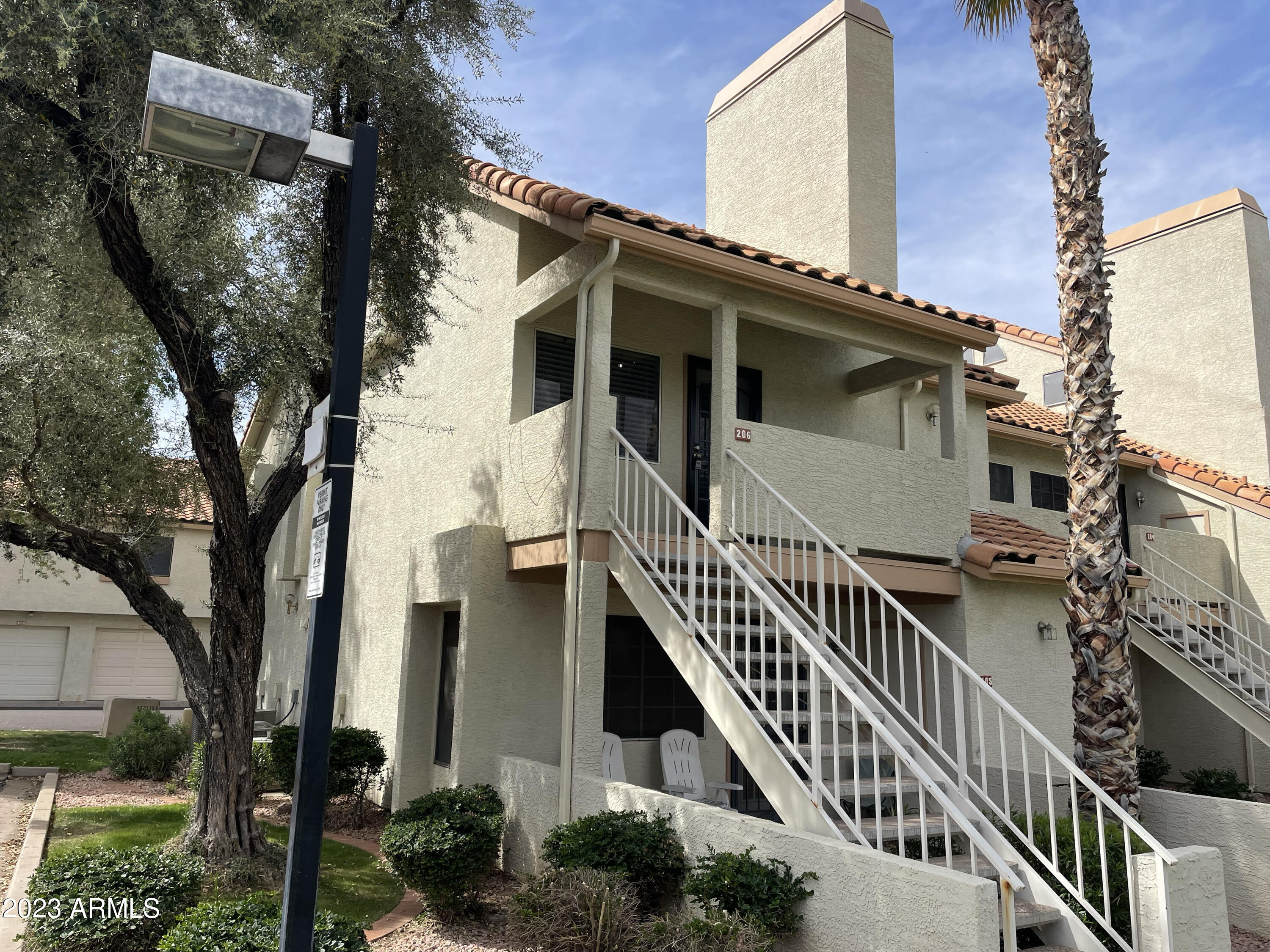 front view of a house with iron stairs