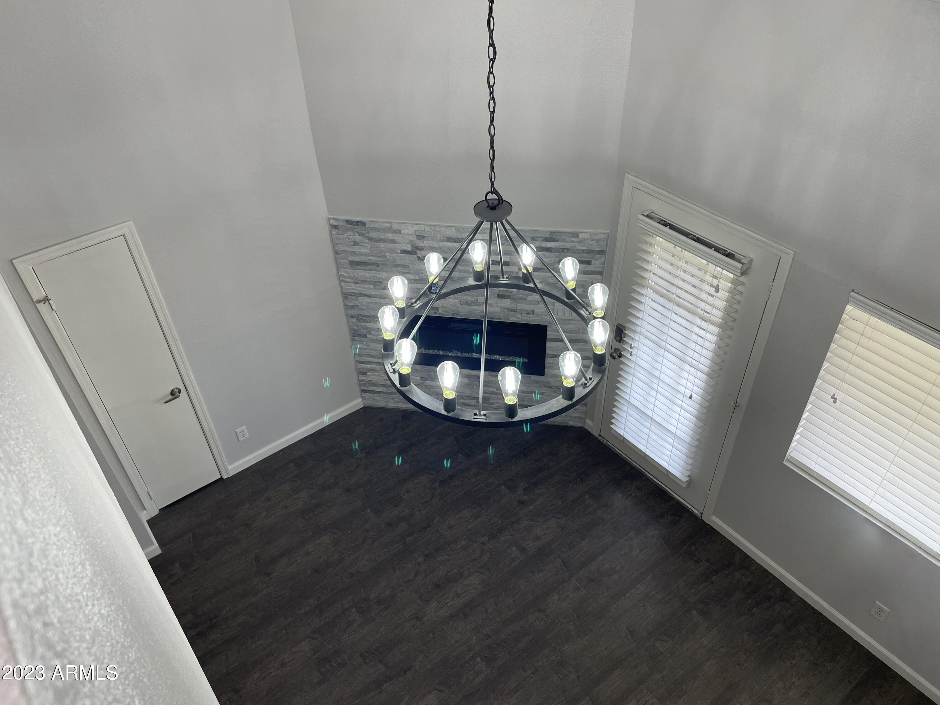 19820 North 13th Avenue, Unit 206 Phoenix, AZ 85027 - Photo 14 of 22 a view of a room with wooden floor and staircase