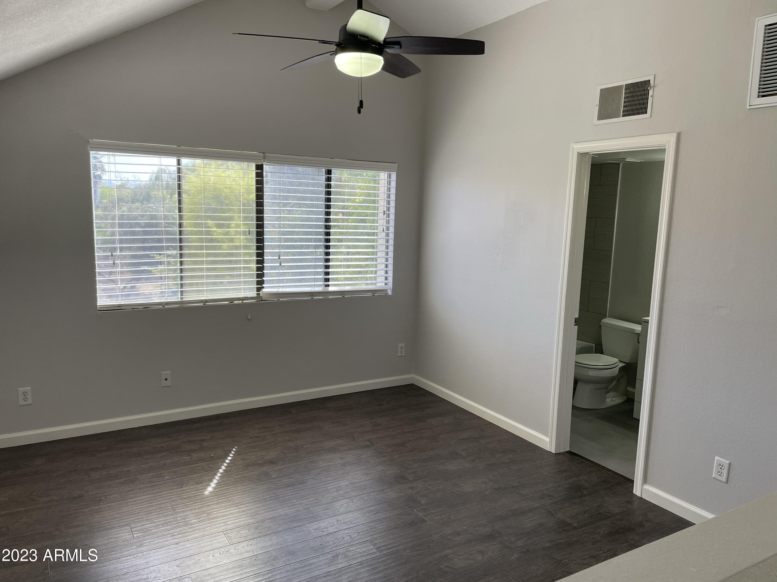 19820 North 13th Avenue, Unit 206 Phoenix, AZ 85027 - Photo 15 of 22 an empty room with a window