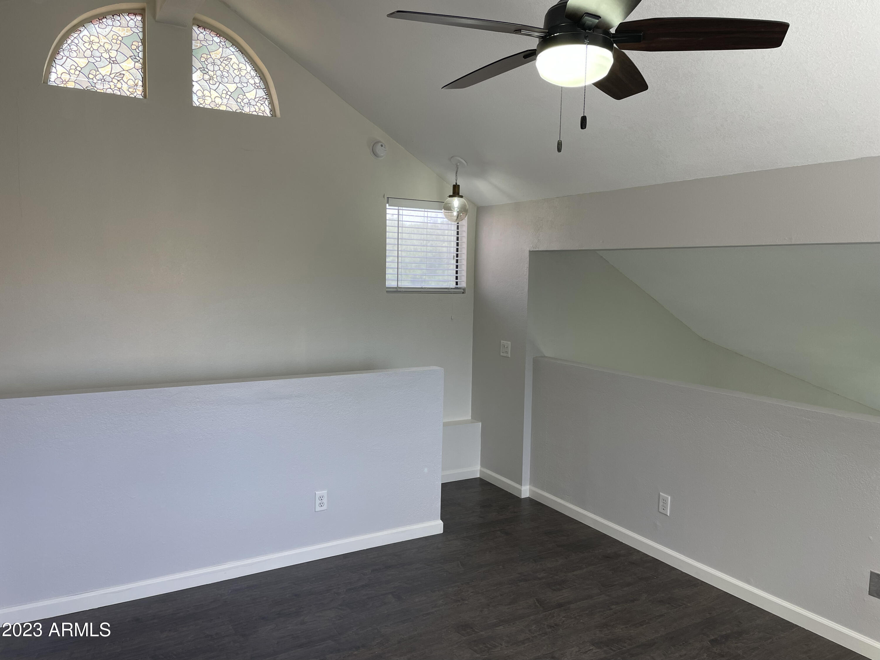 19820 North 13th Avenue, Unit 206 Phoenix, AZ 85027 - Photo 16 of 22 an empty room with windows and fan