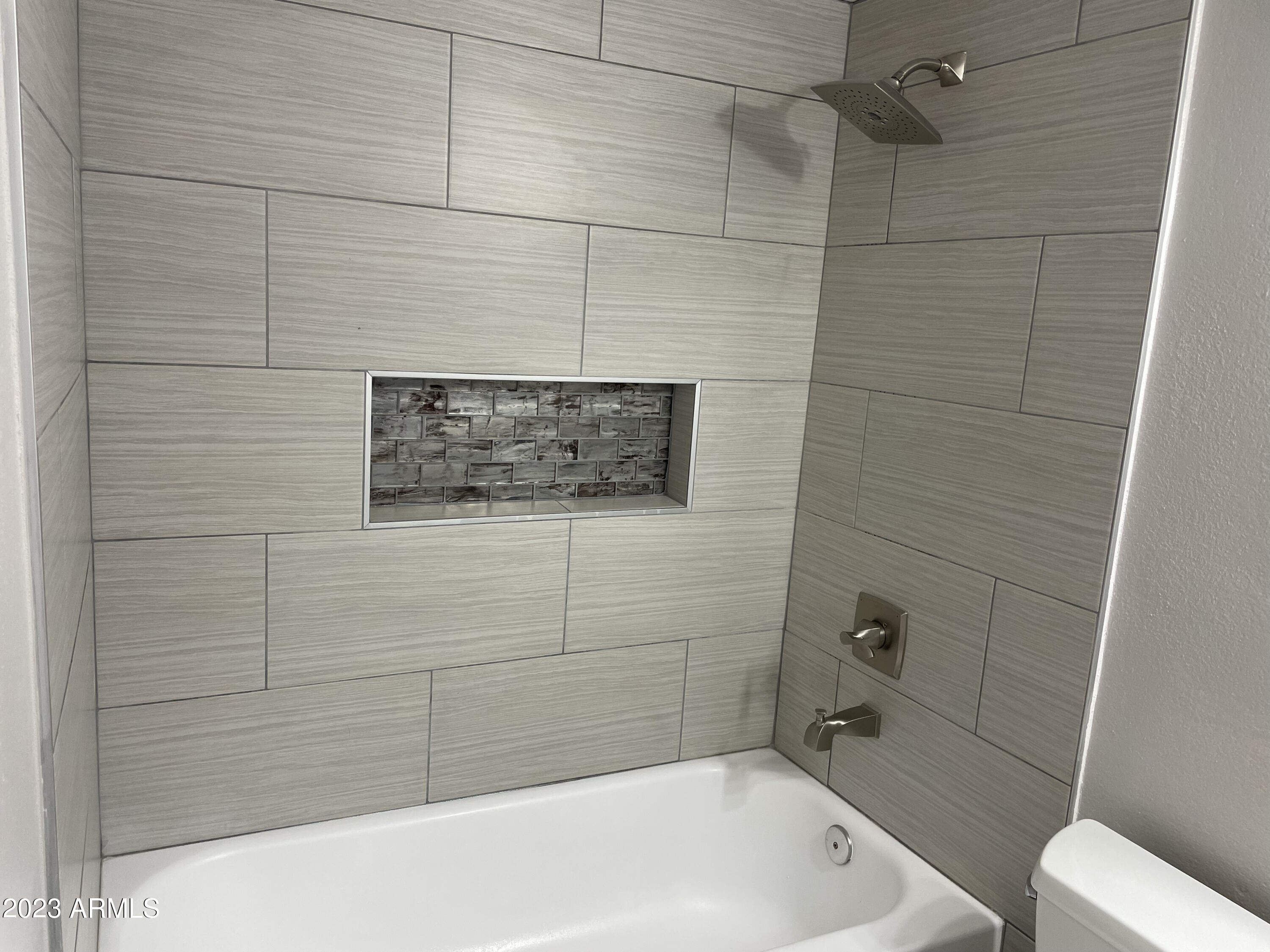 19820 North 13th Avenue, Unit 206 Phoenix, AZ 85027 - Photo 17 of 22 a bathroom with a bathtub and shower