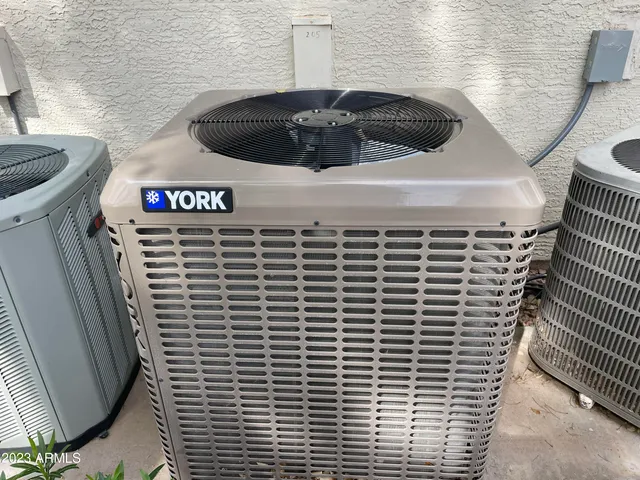 a view of a swimming pool and trees in the background