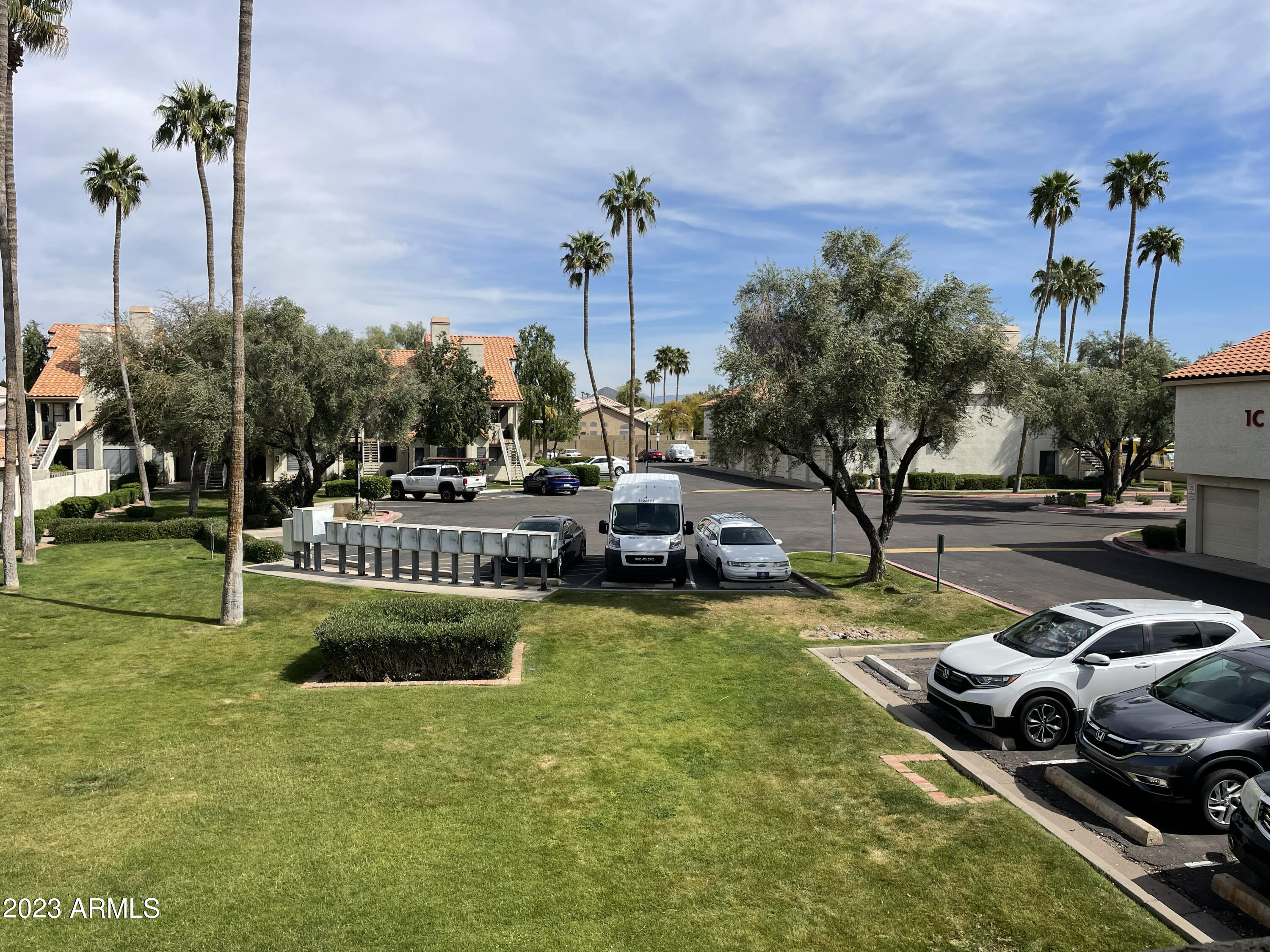 19820 North 13th Avenue, Unit 206 Phoenix, AZ 85027 - Photo 22 of 22 a view of a swimming pool and trees in the background