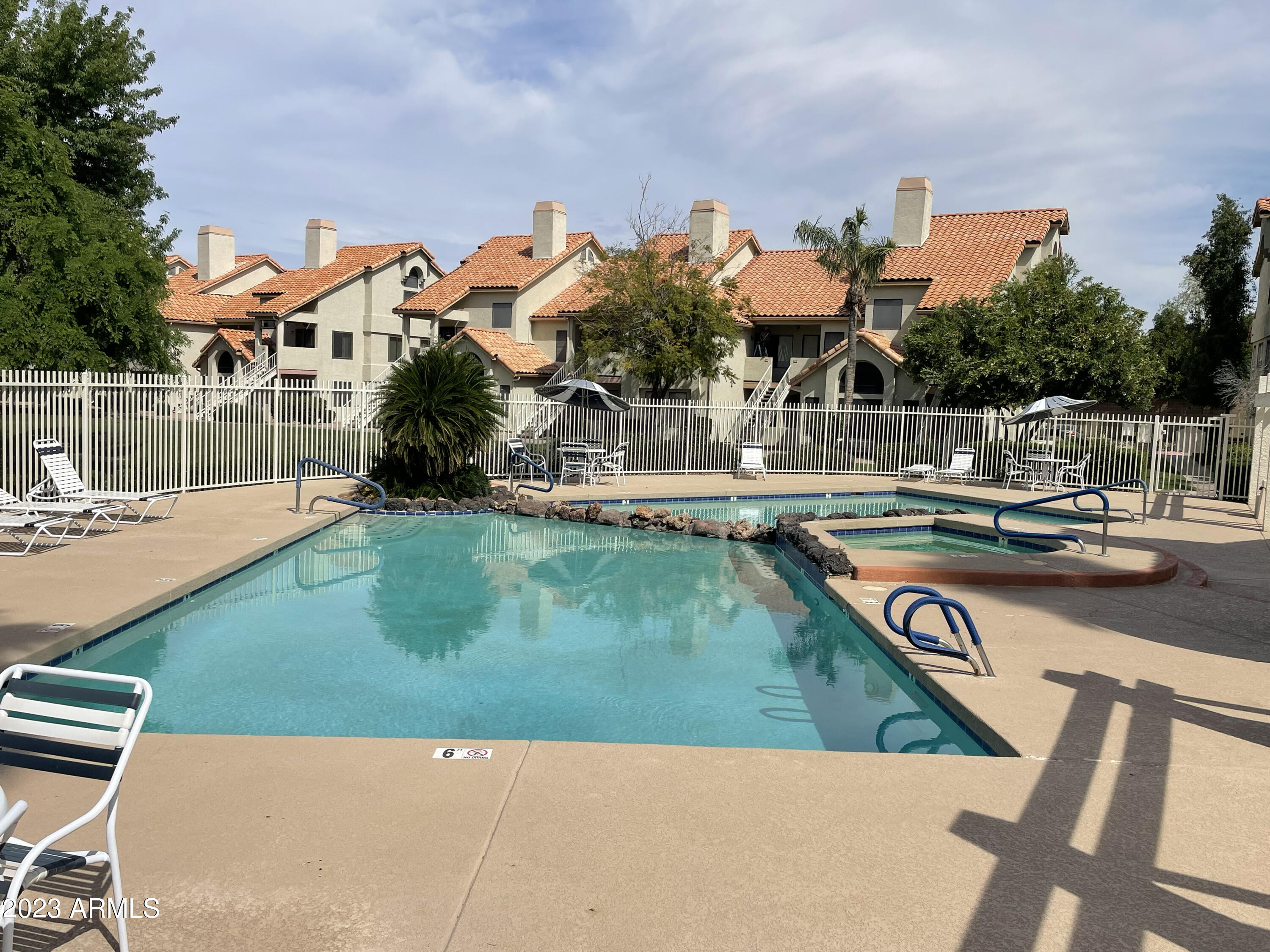 19820 North 13th Avenue, Unit 206 Phoenix, AZ 85027 - Photo 4 of 22 a view of a lake with a park