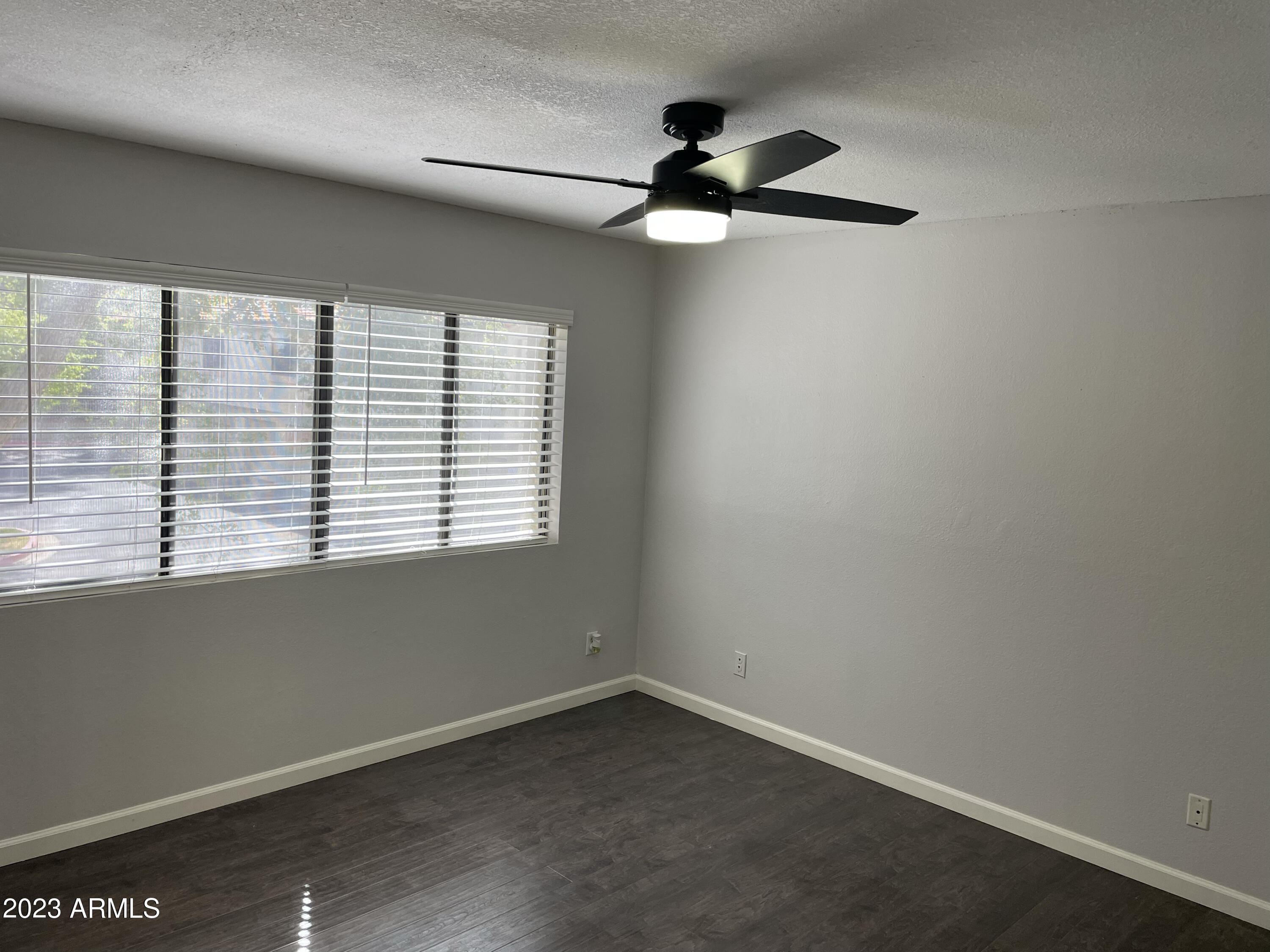 19820 North 13th Avenue, Unit 206 Phoenix, AZ 85027 - Photo 10 of 22 an empty room with a window