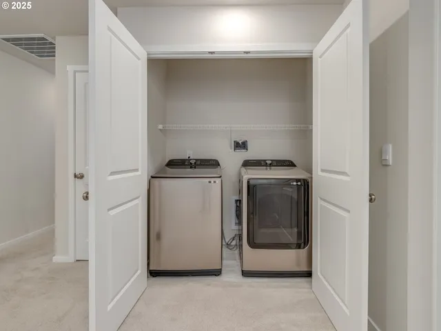 a utility room with washer and dryer