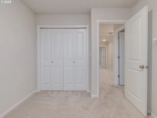 an empty room with closet area
