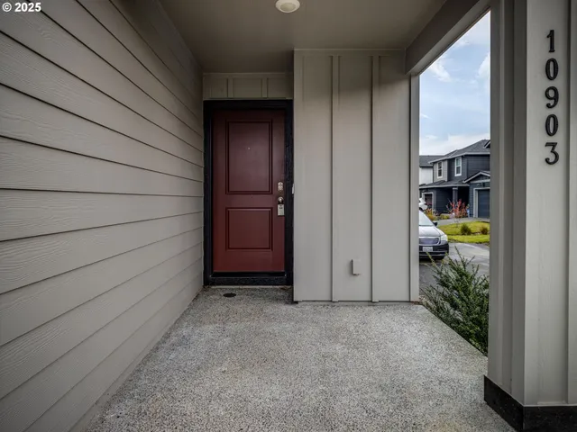 a view of a house with a backyard and balcony