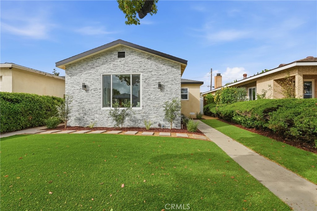 3435 Olive Avenue Long Beach, CA 90807 - Photo 1 of 1 a front view of a house with a yard