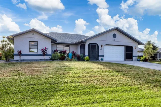 a front view of house with yard and outdoor seating
