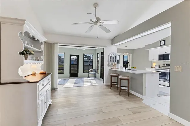 a kitchen with stainless steel appliances a sink and cabinets