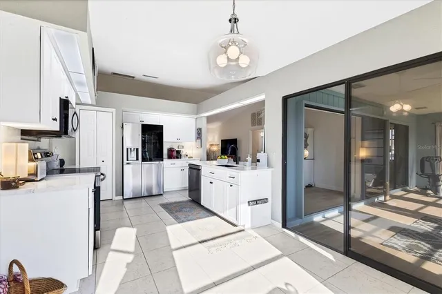 a view of an entryway with chandelier