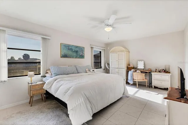 a bathroom with a granite countertop toilet and a shower