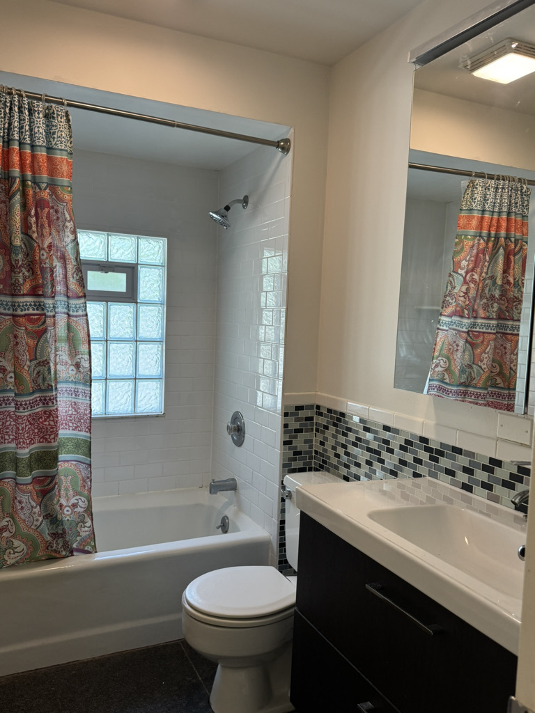 2414 Maple Avenue Downers Grove, IL 60515 - Photo 11 of 17 a bathroom with a sink toilet tub and shower