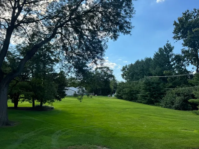 a backyard of a house with lots of green space