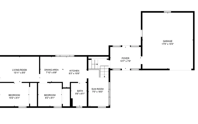 a black and white photo of a living room