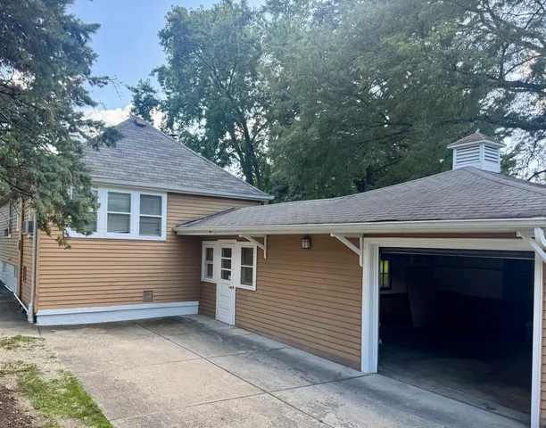 a view of house with a backyard space