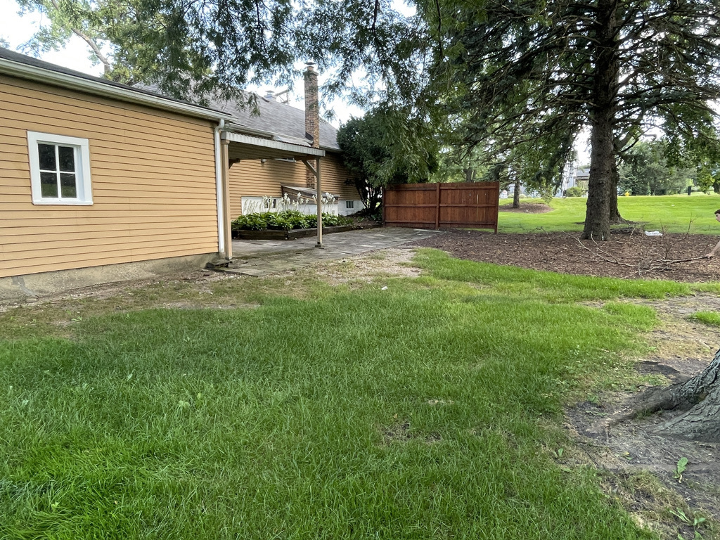 2414 Maple Avenue Downers Grove, IL 60515 - Photo 6 of 17 a view of a backyard with a garden and trees