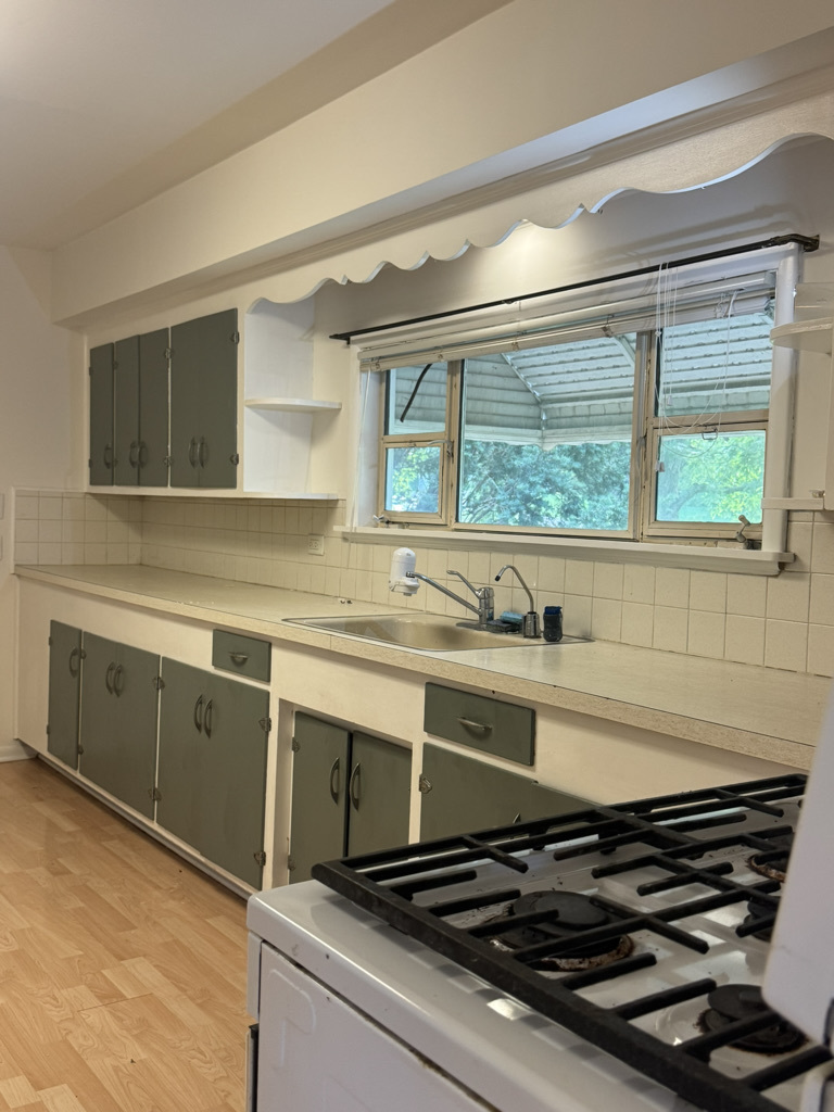 2414 Maple Avenue Downers Grove, IL 60515 - Photo 7 of 17 a kitchen with a stove and a sink