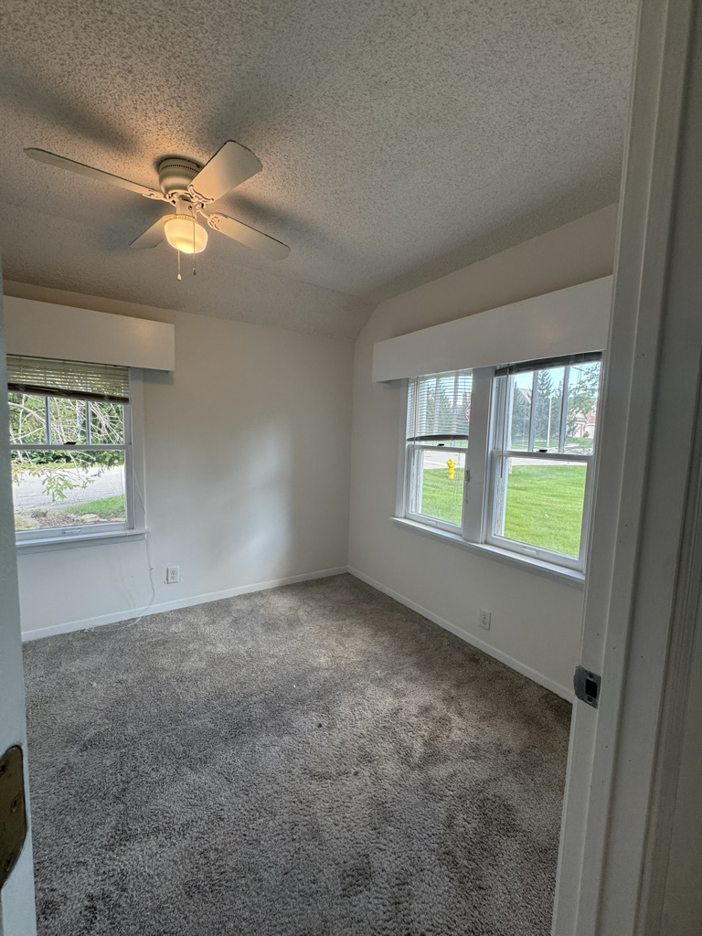 2414 Maple Avenue Downers Grove, IL 60515 - Photo 10 of 17 an empty room with windows and fan
