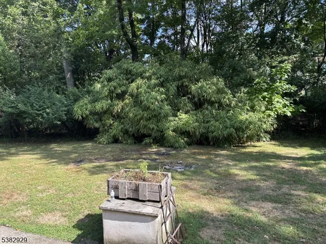 a view of swimming pool with a yard