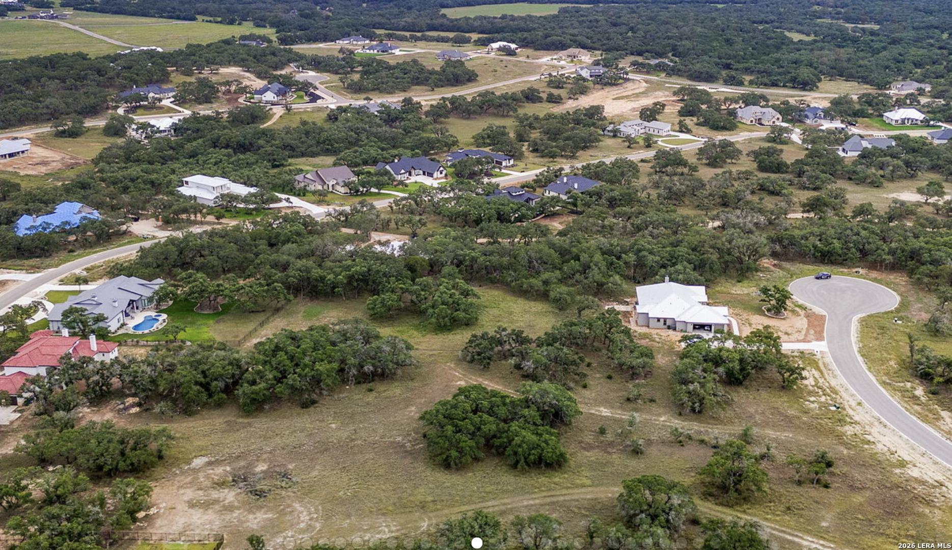 34788 High Gate Road Bulverde, TX 78163 - Photo 7 of 29 an aerial view of a house with a yard and lake