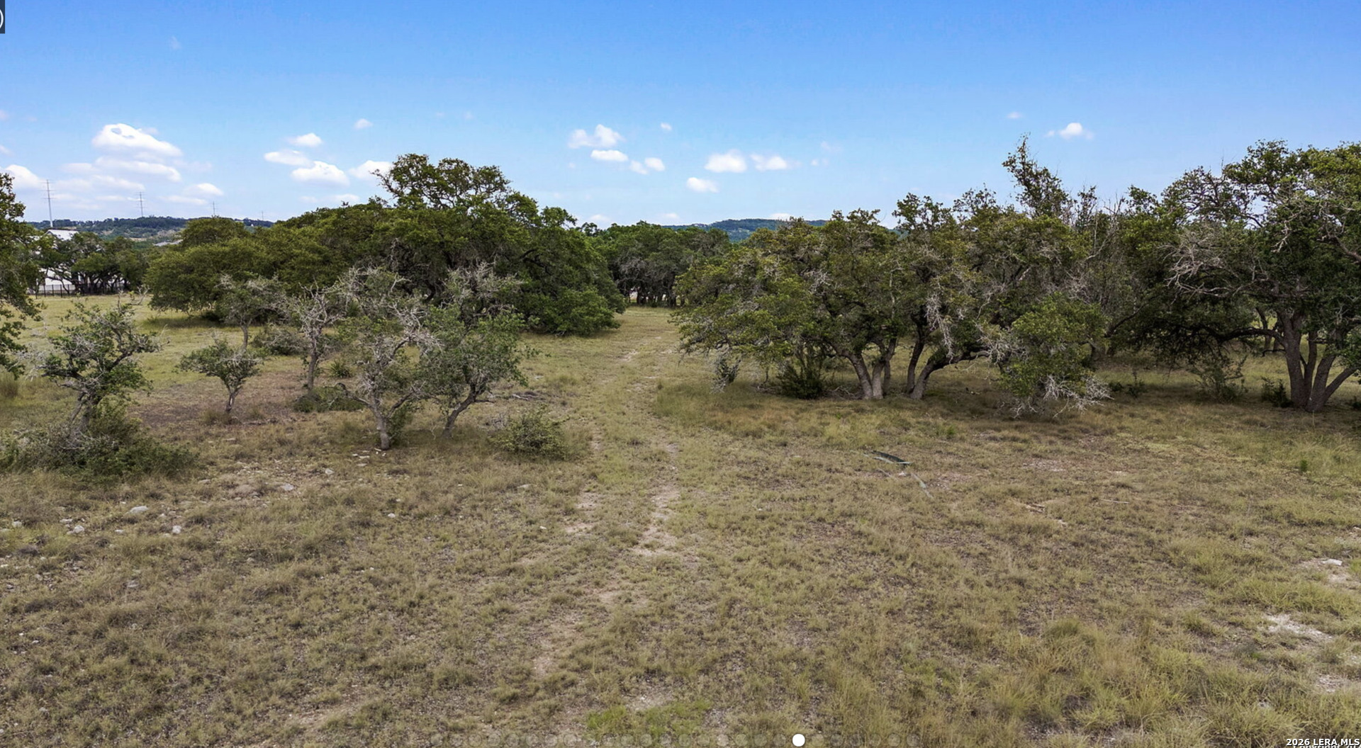 34788 High Gate Road Bulverde, TX 78163 - Photo 10 of 29 a view of a dry yard with trees