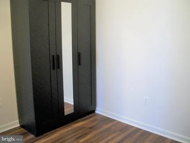a view of front door with wooden floor