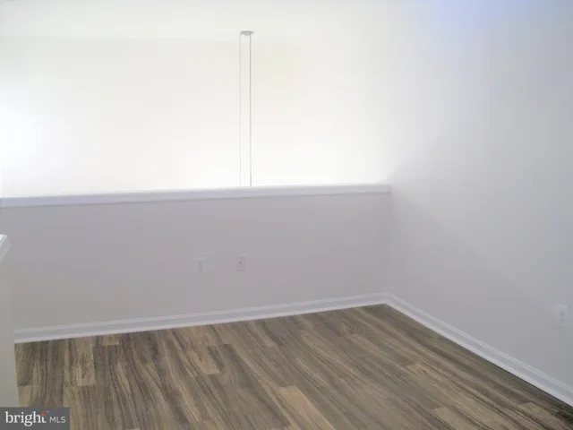 a view of a balcony with wooden floor