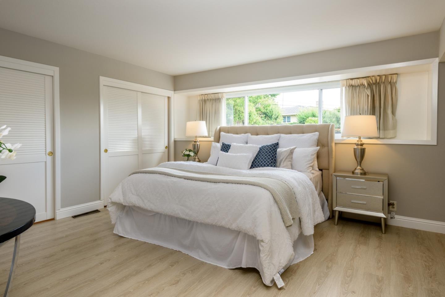 95 Avondale Road Hillsborough, CA 94010 - Photo 12 of 25 a bedroom with a bed and a chair