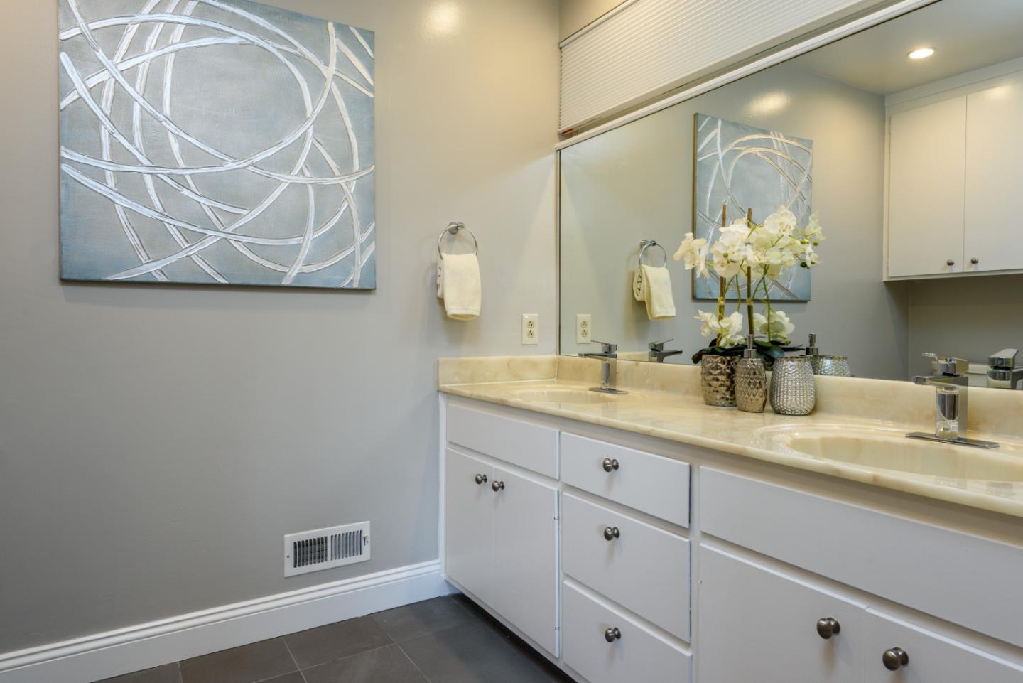 95 Avondale Road Hillsborough, CA 94010 - Photo 14 of 25 a bathroom with a sink and a mirror