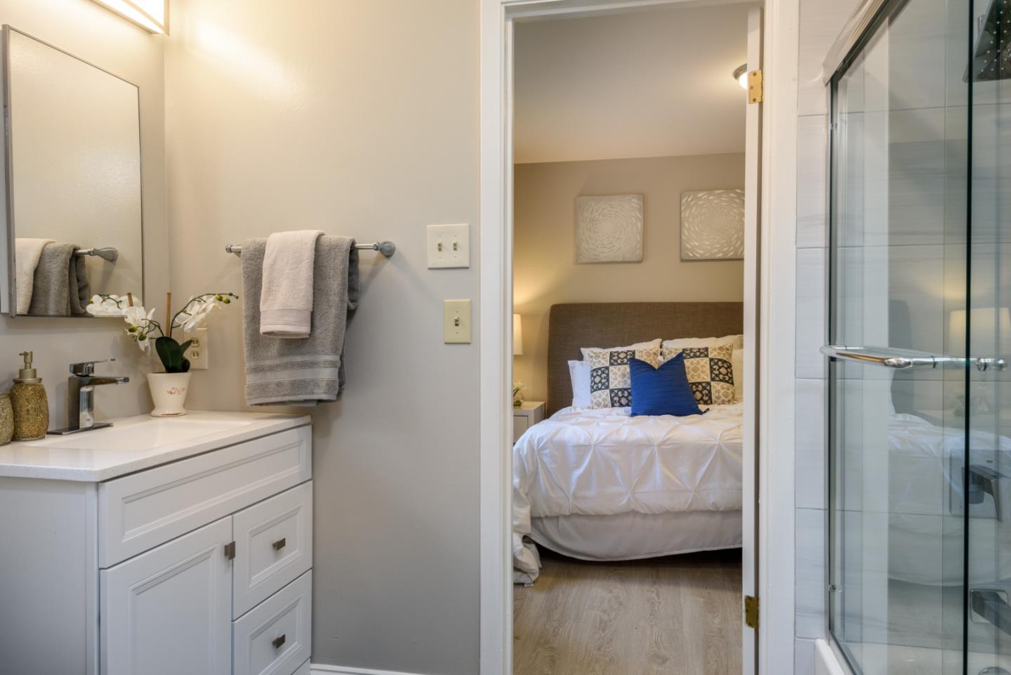 95 Avondale Road Hillsborough, CA 94010 - Photo 17 of 25 a bedroom with a bed and a view of bathroom