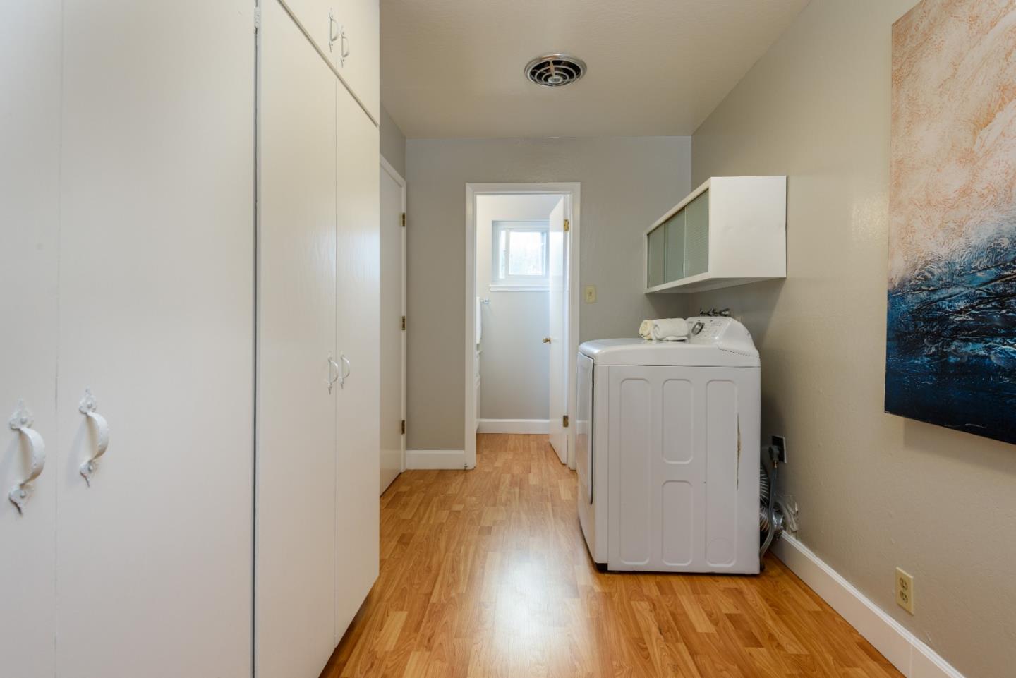 95 Avondale Road Hillsborough, CA 94010 - Photo 19 of 25 a utility room with wooden floor washer and dryer