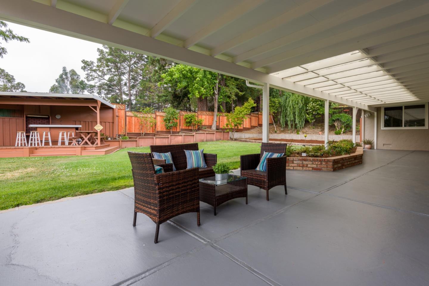95 Avondale Road Hillsborough, CA 94010 - Photo 20 of 25 a view of a patio with chairs and a yard